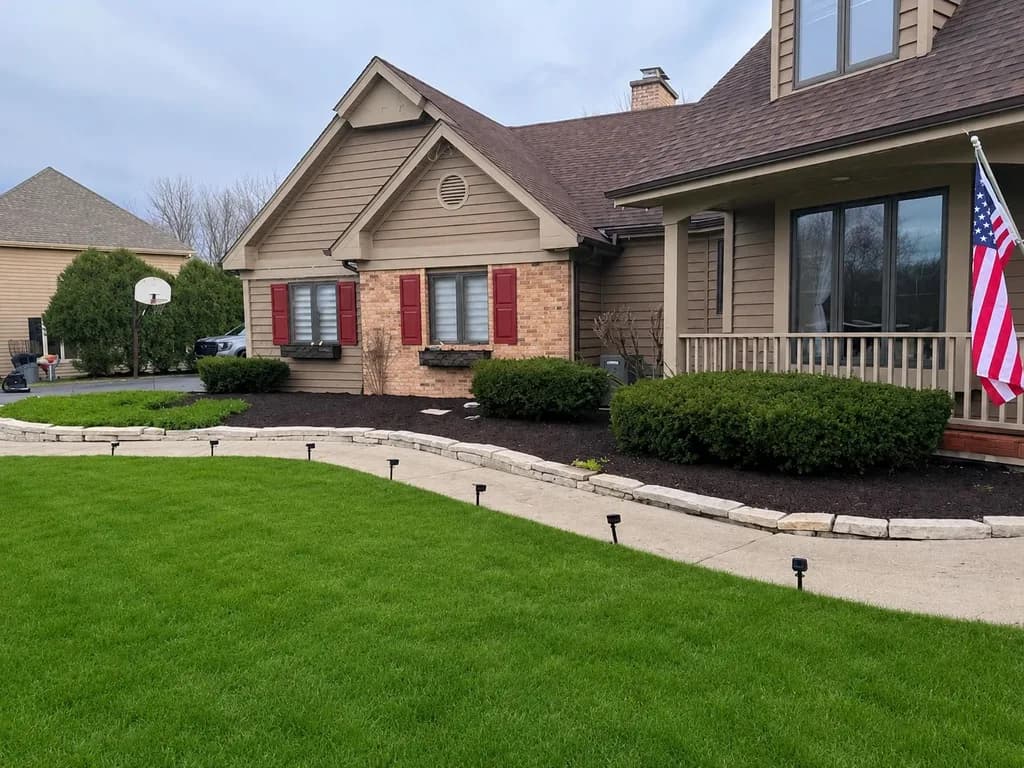 Manicured lawn and mulched beds after a seasonal clean-up